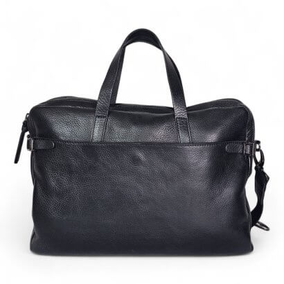 Black leather handbag with two short handles and a top zipper on a white background.