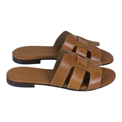 Brown leather slide sandals with stitched cutout straps and padded footbed, casual summer footwear