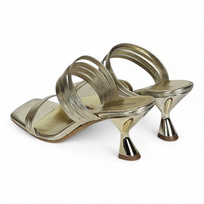 Gold strappy high-heeled sandals with metallic bands and curved heels.