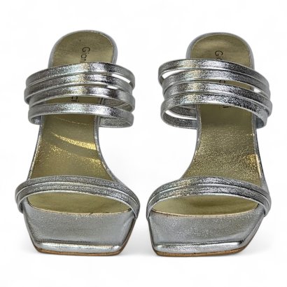 Two silver sandals with multiple metallic straps, photographed from above (open-toe, square toe).