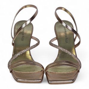 Metallic rose-gold heeled sandals with crisscross straps viewed from the front, two shoes side by side
