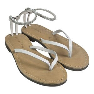 Beige flat sandal with white thong straps and a sparkly rhinestone ankle strap. Brand Gianmarco Ricci.