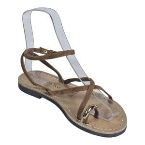 Brown suede strappy sandal with thin straps and beige sole, shown on a clear display form for photography.