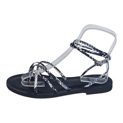 Sandal with black sole and clear, patterned straps crisscrossing over the foot