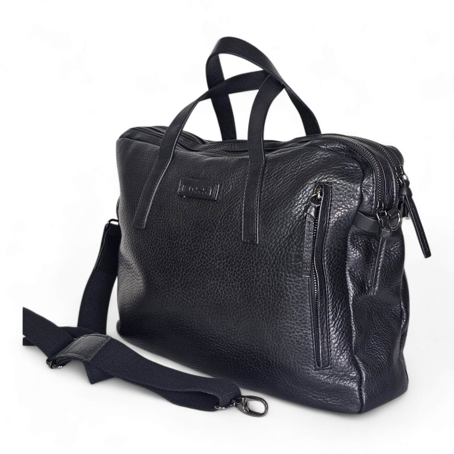 Black textured leather bag with two top handles and multiple zippers on a white background (bag viewed from side). Used as a shoulder/mest bag accessory.